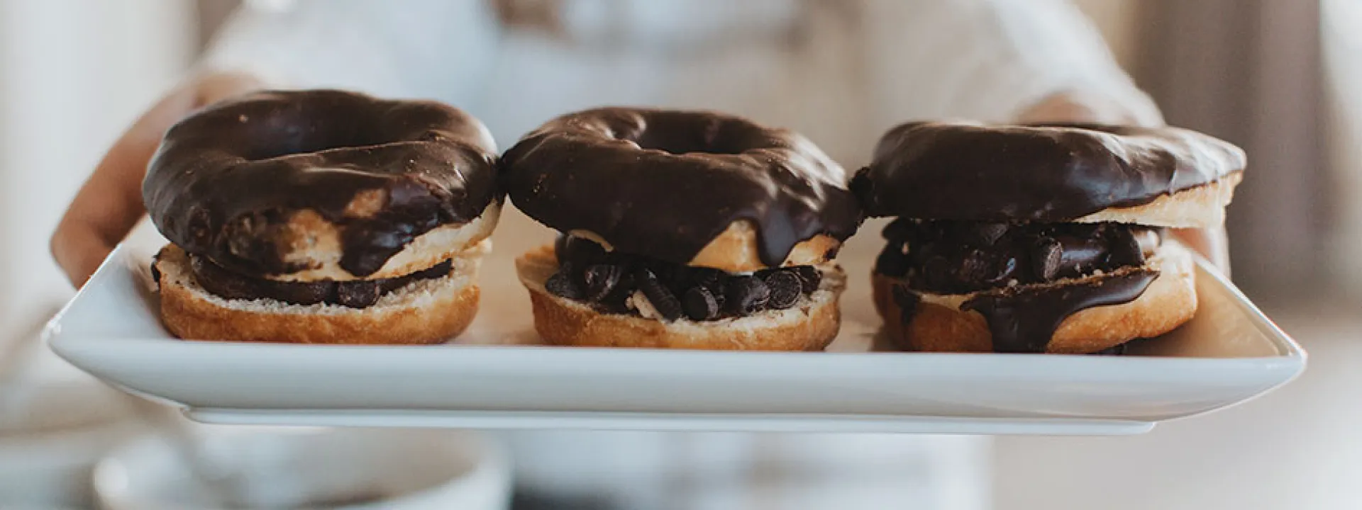Chocolate frosting on donuts served with Wesley Andrews coffee