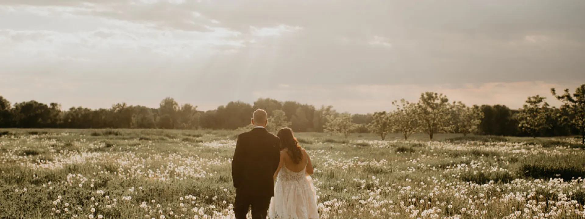 A remote field during golden hour made for stunning photos of the bride and groom.