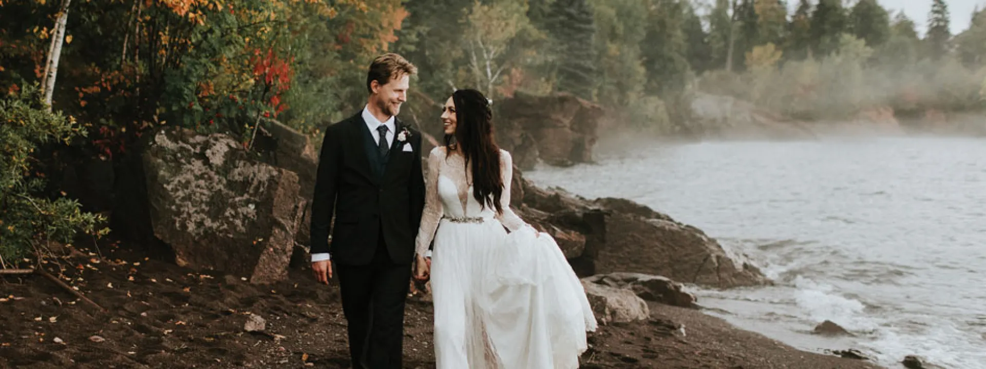 Bride and groom on the windswept coast of Lake Superior.