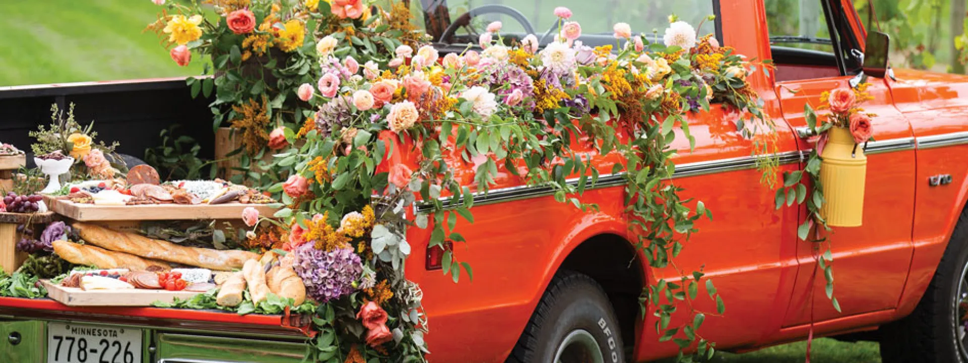 A '50s Chevy truck bedecked with bright florals and resplendent charcuterie.